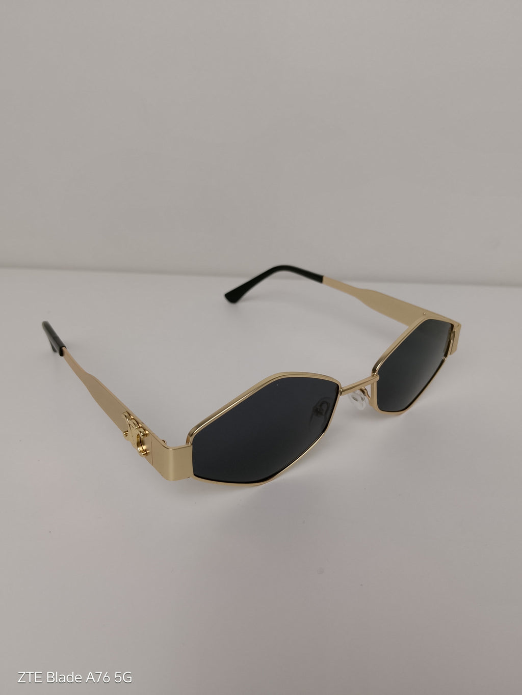 Celine Triangular