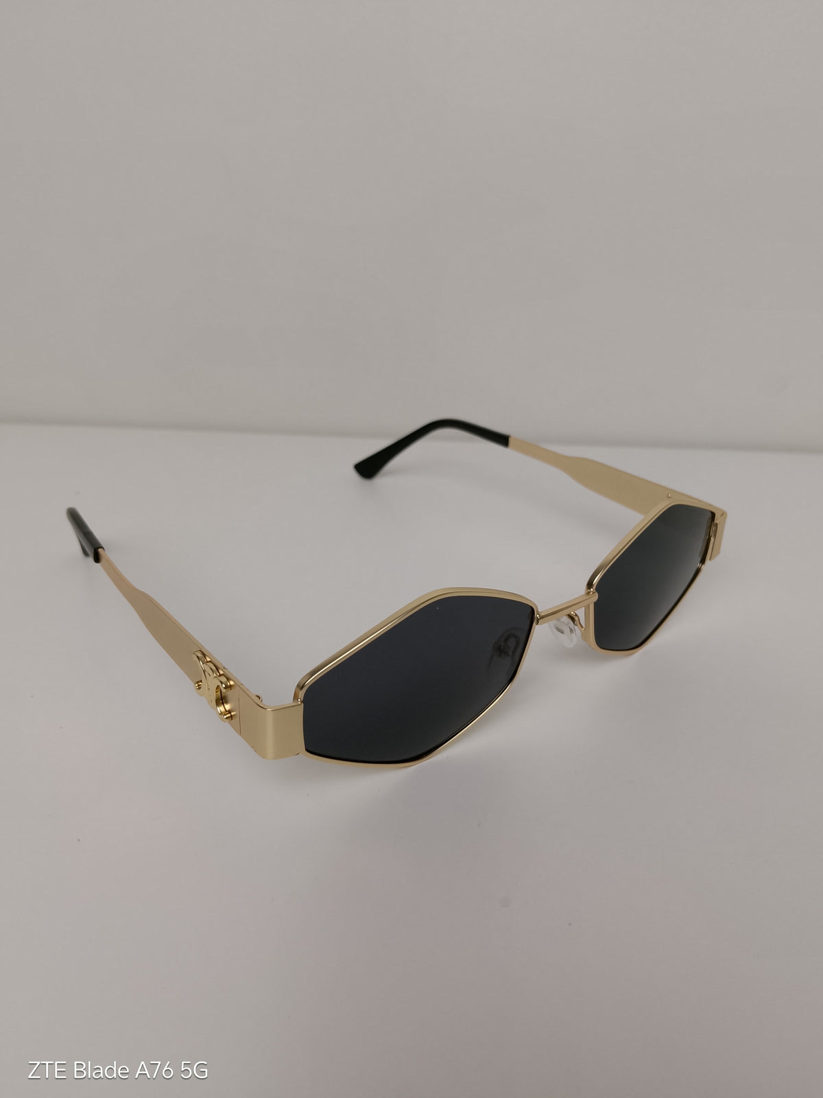 Celine Triangular
