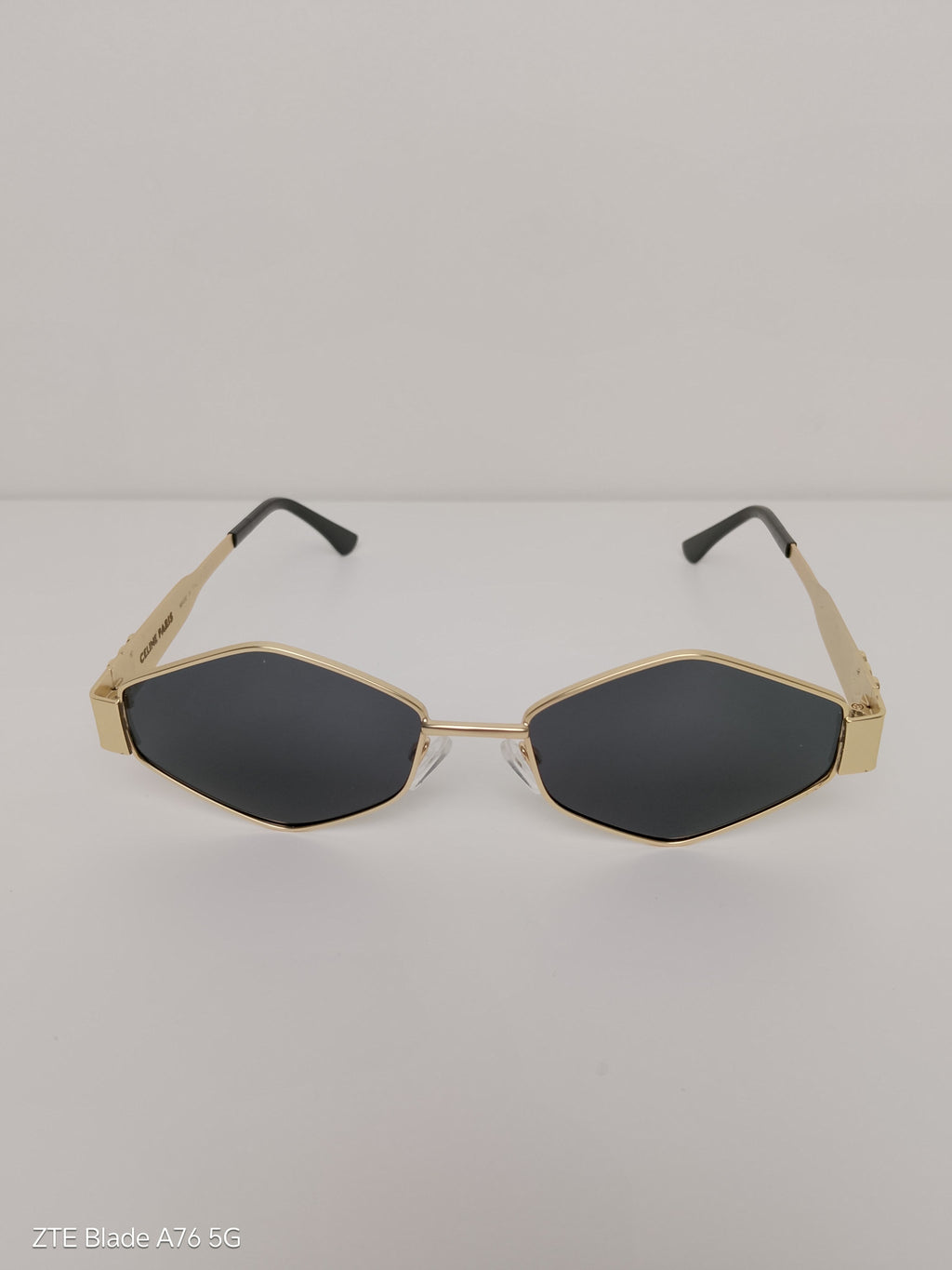 Celine Triangular