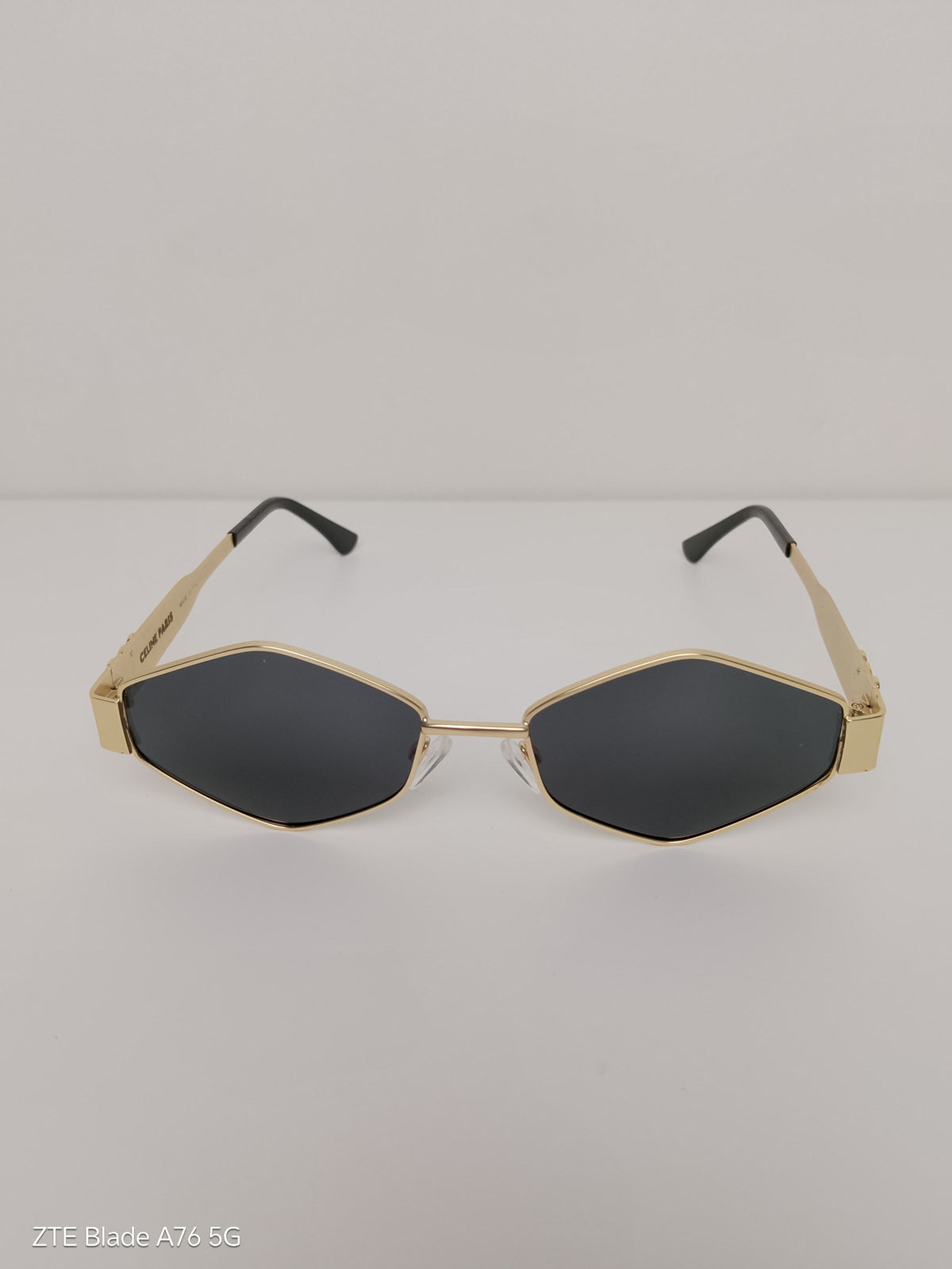 Celine Triangular