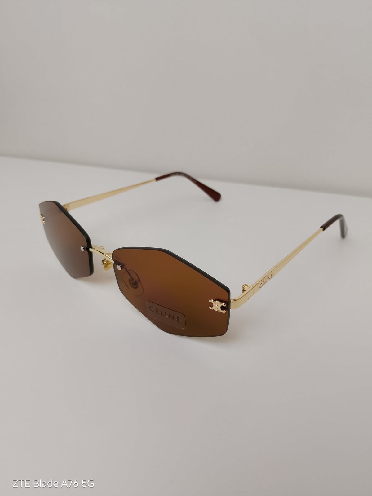 Celine Triangular
